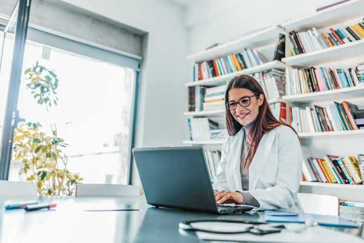 woman doctor working on laptop