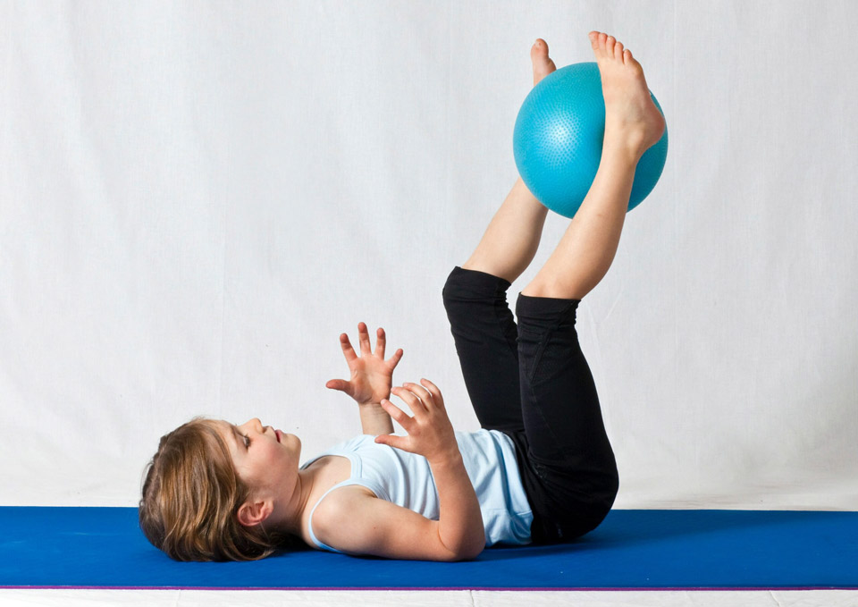 Pediatric physical therapy exercises using medicine ball