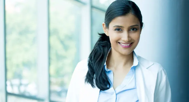 woman doctor looking at camera