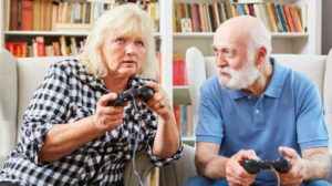 2 Seniors playing video games during occupational therapy